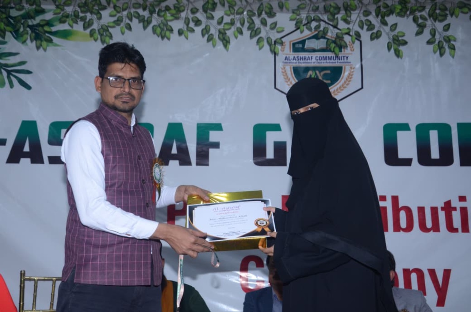 Award presentation at Al Ashraf event